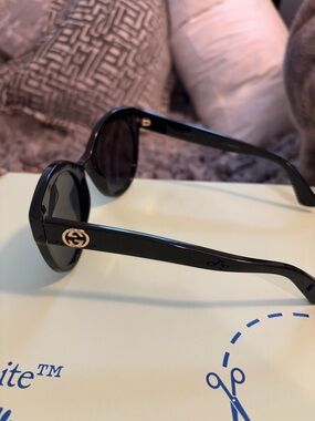Gucci Black Round Sunglasses with Gold GG Accent